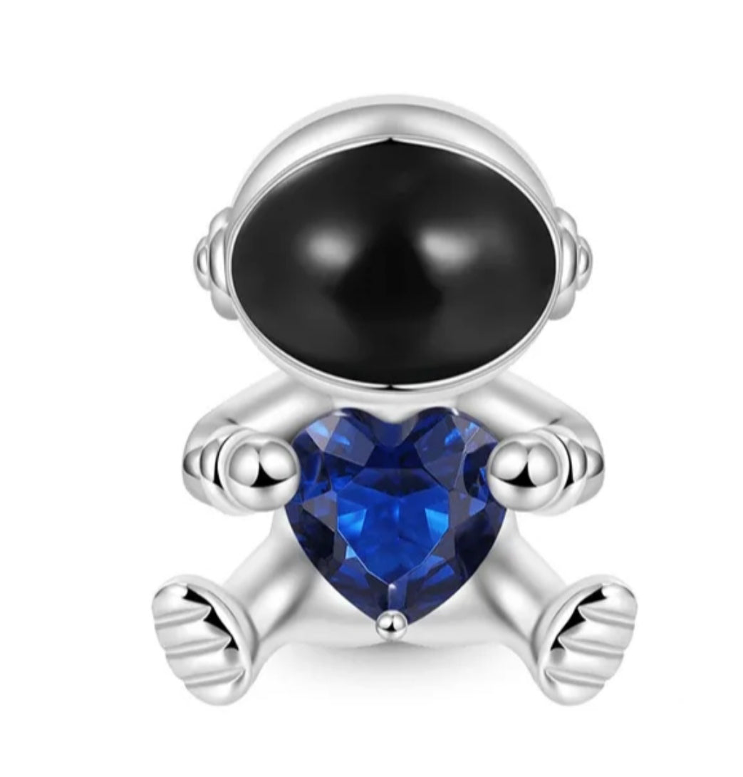 Charm astronauta con cristal azul de plata s925